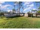 Large backyard featuring green grass, a storage shed, and ample space for outdoor activities at 1959 9Th Ave, Deland, FL 32724