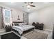 Light-filled bedroom features two windows, stylish curtains, and a comfortable bed with decorative pillows at 1959 9Th Ave, Deland, FL 32724