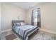 Bright bedroom with a cozy bed, soft rug, and a window offering plenty of natural light at 1959 9Th Ave, Deland, FL 32724