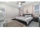 This bedroom offers a comfortable bed, two windows, and neutral colors, perfect for relaxation at 1959 9Th Ave, Deland, FL 32724