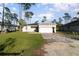 Well-maintained single-story home featuring a brick driveway and an attached two-car garage at 1959 9Th Ave, Deland, FL 32724