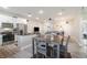 Open concept kitchen with white cabinetry, stainless steel appliances, and dining area at 1959 9Th Ave, Deland, FL 32724