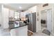 Modern kitchen with stainless steel appliances, white cabinets, and a central island at 1959 9Th Ave, Deland, FL 32724