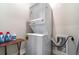 Efficient laundry area with stacked washer and dryer, maximizing space for convenience at 1959 9Th Ave, Deland, FL 32724