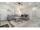 Inviting living room with neutral walls, modern gray sofas, and a ceiling fan at 1959 9Th Ave, Deland, FL 32724