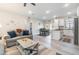 Open living space connecting to the kitchen and dining area with modern furnishings and decor at 1959 9Th Ave, Deland, FL 32724