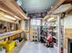 Unfinished basement/storage with workbench, shelving, and lots of storage at 200 Patricia Pl, Davenport, FL 33897