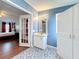 Bathroom and bedroom view features french doors, patterned flooring and a vanity at 200 Patricia Pl, Davenport, FL 33897