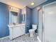 Beautifully remodeled bathroom with a new glass shower, vanity, and patterned flooring at 200 Patricia Pl, Davenport, FL 33897