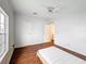 Bright bedroom features a ceiling fan, wood-look floors, and a window providing natural light at 200 Patricia Pl, Davenport, FL 33897