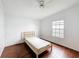 Bedroom with wood-look floors, neutral paint and a window providing natural light at 200 Patricia Pl, Davenport, FL 33897