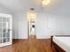 Bedroom with wood-look floors, neutral paint and a ceiling fan at 200 Patricia Pl, Davenport, FL 33897