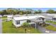 This home features a double carport, beautifully landscaped garden, and a cozy, welcoming entrance at 200 Patricia Pl, Davenport, FL 33897