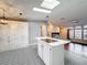 Kitchen featuring an island with white cabinets, stainless steel appliances, and mosaic tile flooring at 200 Patricia Pl, Davenport, FL 33897