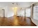 Cozy living room with wood floors, white door and plenty of natural light at 200 Patricia Pl, Davenport, FL 33897