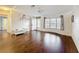 Bright living room featuring wood floors, a large window and front door at 200 Patricia Pl, Davenport, FL 33897