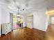 Spacious living room featuring wood floors, glass sliding door and a cabinet at 200 Patricia Pl, Davenport, FL 33897
