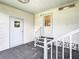 Front entrance with a covered porch and railing leading to two doors at 200 Patricia Pl, Davenport, FL 33897