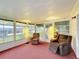 Sunroom with lots of windows, two recliners, and two lamps at 200 Patricia Pl, Davenport, FL 33897