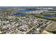 Aerial view of a neighborhood with ponds, mature trees, and residential homes at 2005 Blackbird Dr, Apopka, FL 32703