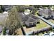 Aerial view of the home with a spacious fenced backyard and mature trees at 2005 Blackbird Dr, Apopka, FL 32703