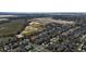 Aerial view of a neighborhood with residential homes, green space, and crosswalks at 2005 Blackbird Dr, Apopka, FL 32703