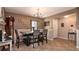 Charming dining room featuring a chandelier, seating for four, and neutral decor at 2005 Blackbird Dr, Apopka, FL 32703