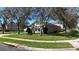 Corner lot home with well-manicured lawn and neat landscaping, street view at 2005 Blackbird Dr, Apopka, FL 32703