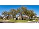 Street view of a cozy home with a well-maintained lawn and mature trees providing shade at 2005 Blackbird Dr, Apopka, FL 32703
