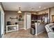 Inviting kitchen area with stainless steel appliances and seamless flow to the living room at 2005 Blackbird Dr, Apopka, FL 32703
