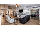 Bright living room featuring a decorative accent wall, neutral furniture, and an open layout at 2005 Blackbird Dr, Apopka, FL 32703