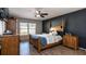 Inviting bedroom with neutral tones, ceiling fan, and ample natural light at 2005 Blackbird Dr, Apopka, FL 32703