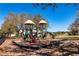 Neighborhood playground with slides and climbing features on a wood chip surface at 2005 Blackbird Dr, Apopka, FL 32703