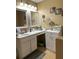 Bathroom featuring vanity with a large mirror and great countertop space for added convenience at 203 Flounder Pl, Kissimmee, FL 34759