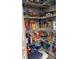 Organized pantry features wire shelving maximizing storage space for food and household items at 203 Flounder Pl, Kissimmee, FL 34759