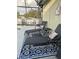 Outdoor pool area with comfortable lounge chairs, an area rug and decorative pillows at 203 Flounder Pl, Kissimmee, FL 34759