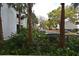 Exterior view of building with tropical landscaping at 206 E South St # 1018, Orlando, FL 32801