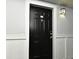 Elegant black front door with a classic design and a stylish door knocker at 206 E South St # 1018, Orlando, FL 32801