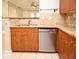 Kitchen featuring granite countertops and a stainless steel dishwasher at 206 E South St # 1018, Orlando, FL 32801