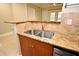 Kitchen featuring granite countertops and a double sink at 206 E South St # 1018, Orlando, FL 32801