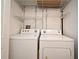 Laundry room featuring a side-by-side washer and dryer and wire shelving at 206 E South St # 1018, Orlando, FL 32801