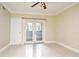This light-filled living room offers tiled floors and access to the outdoors at 206 E South St # 1018, Orlando, FL 32801