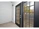 Stylish black patio doors with multi-pane windows leading to a private outdoor space at 206 E South St # 1018, Orlando, FL 32801