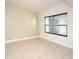 Bright room with tiled floor, neutral wall paint, and a window with blinds at 206 E South St # 1018, Orlando, FL 32801