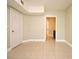 Room with tiled floors, neutral paint, and a door leading to another room at 206 E South St # 1018, Orlando, FL 32801