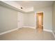 Open room featuring tile flooring, neutral walls, and view to another room at 206 E South St # 1018, Orlando, FL 32801