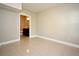 Tiled room with neutral paint, view to bathroom, and ample electrical outlets at 206 E South St # 1018, Orlando, FL 32801