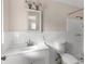 Bathroom featuring vanity sink with an framed mirror, tiled walls, and shower at 20639 Sw Rainbow Lakes Blvd, Dunnellon, FL 34431