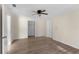 Cozy bedroom with ceiling fan, neutral walls, closet, and wood style flooring at 20639 Sw Rainbow Lakes Blvd, Dunnellon, FL 34431