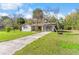 The house features a cozy front porch and well-maintained lawn at 20639 Sw Rainbow Lakes Blvd, Dunnellon, FL 34431